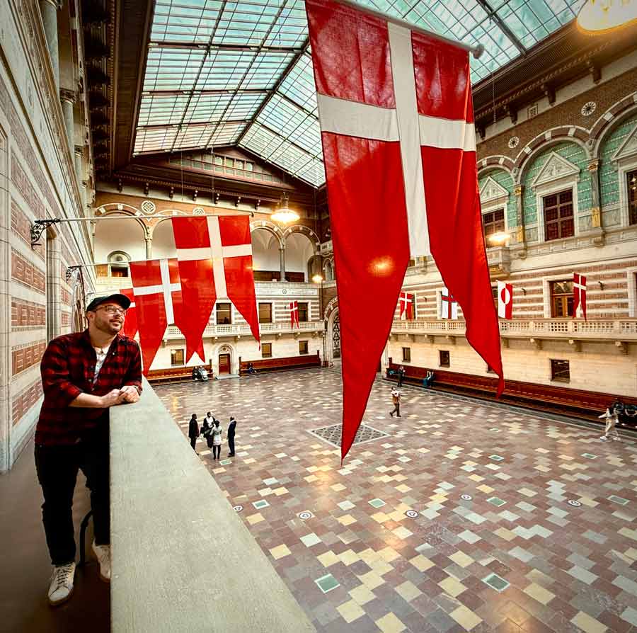Michael Green looking at Denmark flags